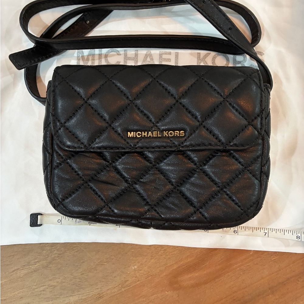 Michael Kors Black Quilted Leather Crossbodywear as a crossbody or a waisted   B